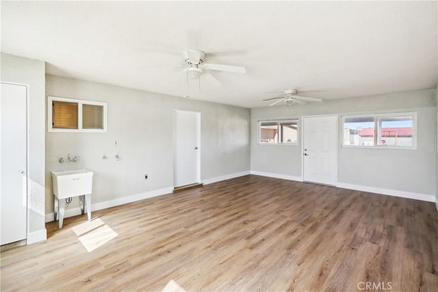 16621 Verano St, Hesperia, CA 92345 - unfurnished living room with ceiling fan, light wood-style flooring, and baseboards