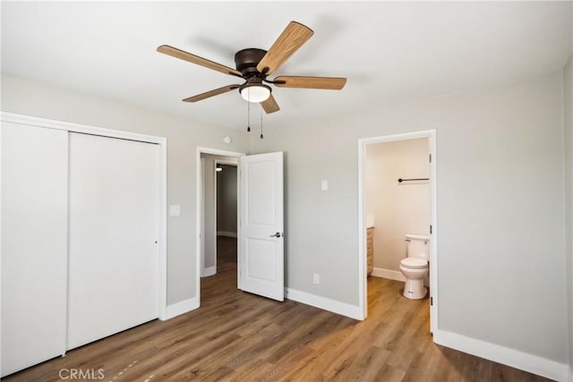 16621 Verano St, Hesperia, CA 92345 - unfurnished bedroom featuring a closet, wood finished floors, baseboards, connected bathroom, and ceiling fan