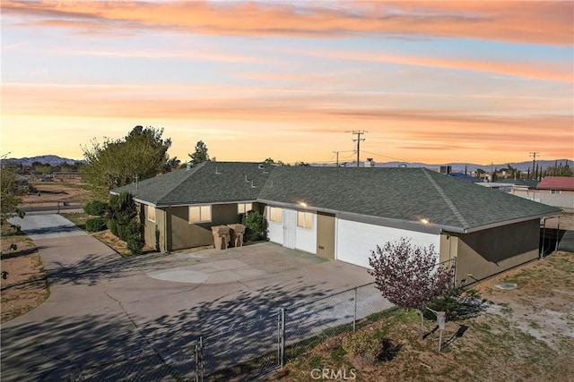 16621 Verano St, Hesperia, CA 92345 - ranch-style home with concrete driveway, a garage, fence, and a shingled roof