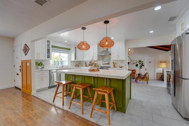 kitchen with visible vents, appliances with stainless steel finishes, and white cabinetry