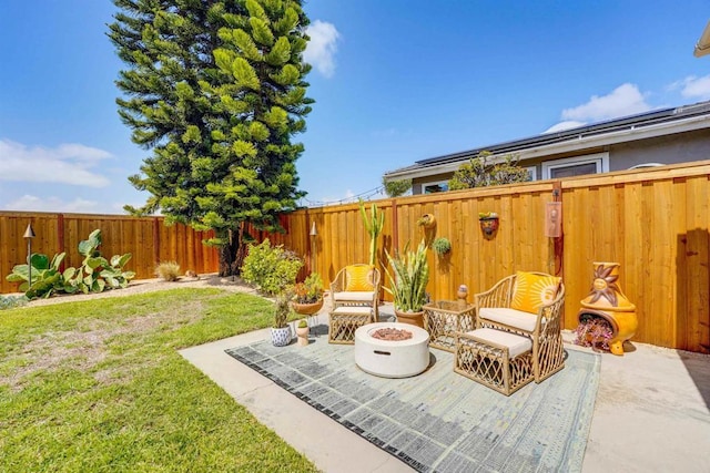 view of patio / terrace with a fire pit and a fenced backyard