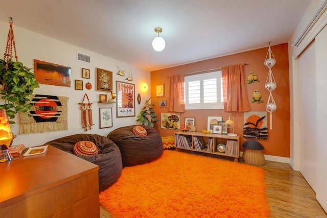 rec room with visible vents and wood finished floors