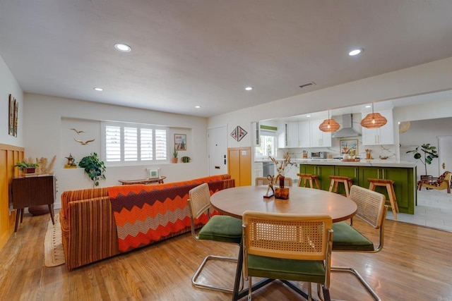 dining room featuring a wealth of natural light and light wood finished floors