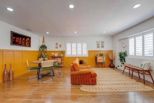 game room featuring visible vents, recessed lighting, light wood-style flooring, and wainscoting