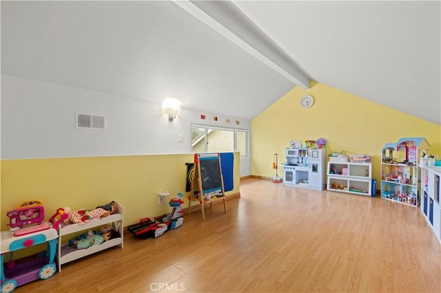 game room featuring visible vents, wood finished floors, and lofted ceiling with beams