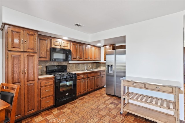 27955 Gallina, Mission Viejo, CA 92692 - kitchen with black appliances, backsplash, light countertops, brown cabinets, and recessed lighting