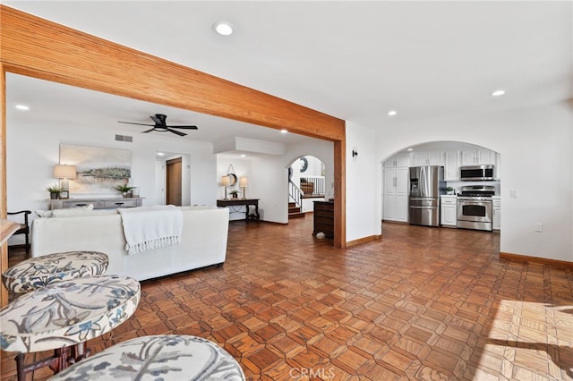27955 Gallina, Mission Viejo, CA 92692 - living room featuring arched walkways, recessed lighting, stairway, and a ceiling fan