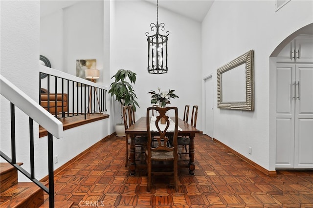 27955 Gallina, Mission Viejo, CA 92692 - dining area with arched walkways, stairs, high vaulted ceiling, and a chandelier