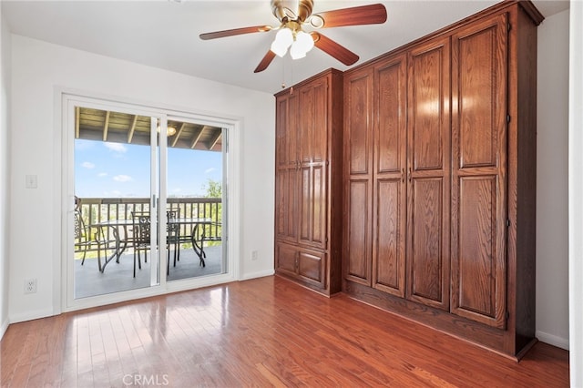 27955 Gallina, Mission Viejo, CA 92692 - unfurnished bedroom featuring access to outside, wood finished floors, and ceiling fan