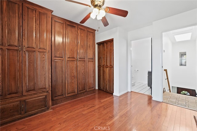 27955 Gallina, Mission Viejo, CA 92692 - unfurnished bedroom featuring wood finished floors, ensuite bath, and a ceiling fan