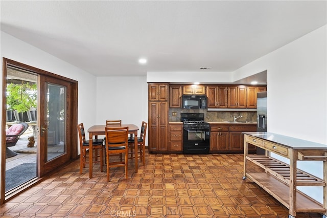 27955 Gallina, Mission Viejo, CA 92692 - kitchen with black appliances, decorative backsplash, brown cabinets, recessed lighting, and light countertops