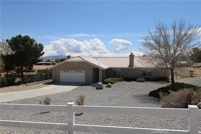 17255 Donert St, Hesperia, CA 92345 - single story home with a tiled roof, stucco siding, fence, an attached garage, and driveway