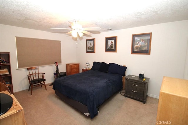 17255 Donert St, Hesperia, CA 92345 - bedroom featuring baseboards, light colored carpet, a textured ceiling, and ceiling fan