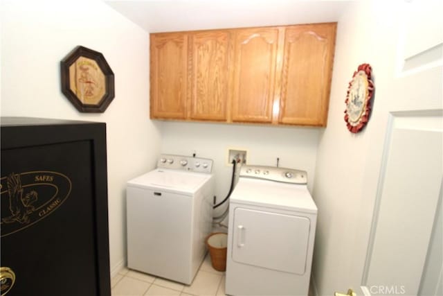 17255 Donert St, Hesperia, CA 92345 - laundry area featuring light tile patterned flooring, washing machine and clothes dryer, and cabinet space