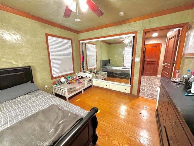 238 Kellog Ave, Fullerton, CA 92833 - bedroom featuring light wood-style floors, ornamental molding, a textured wall, and a ceiling fan