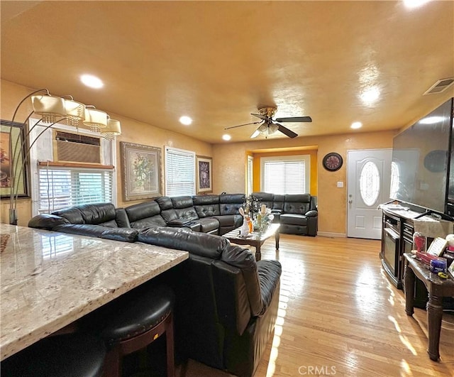 238 Kellog Ave, Fullerton, CA 92833 - living area with light wood finished floors, a wall mounted AC, a ceiling fan, and recessed lighting