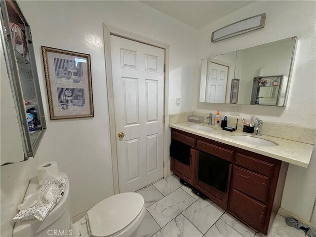 238 Kellog Ave, Fullerton, CA 92833 - bathroom featuring marble look tile flooring and double vanity