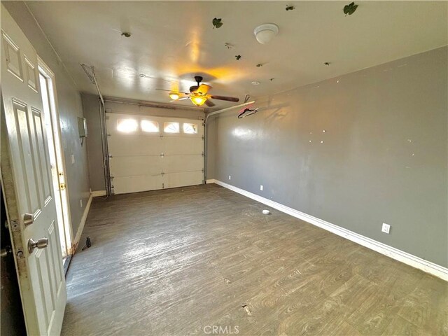 238 Kellog Ave, Fullerton, CA 92833 - garage with baseboards and a ceiling fan