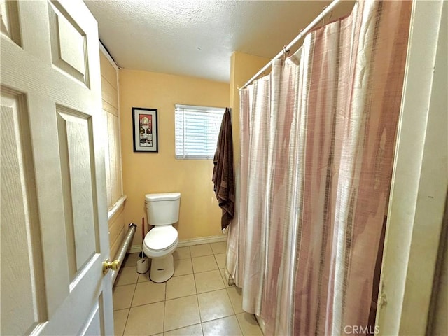 238 Kellog Ave, Fullerton, CA 92833 - bathroom featuring a textured ceiling, tile patterned flooring, and a shower with shower curtain