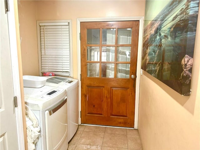238 Kellog Ave, Fullerton, CA 92833 - washroom featuring washer and dryer and light tile patterned floors