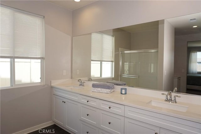 34539 Velvetleaf St, Winchester, CA 92596 - bathroom with a shower stall, double vanity, and baseboards