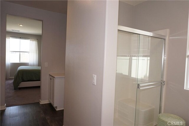 34539 Velvetleaf St, Winchester, CA 92596 - bathroom with a shower stall, wood finished floors, ensuite bath, and baseboards