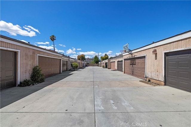 view of street featuring community garages