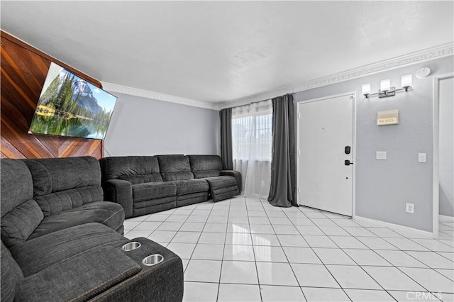 living area with crown molding, light tile patterned floors, and baseboards