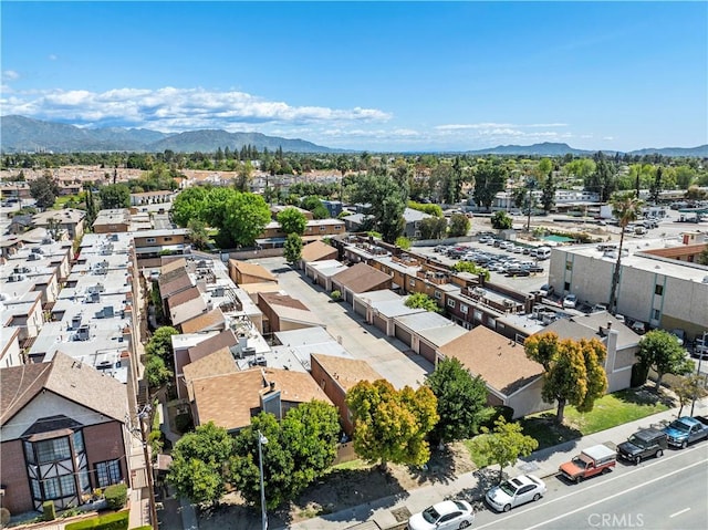 birds eye view of property featuring a mountain view and a residential view