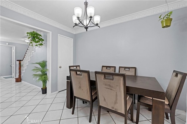 dining room featuring baseboards, light tile patterned floors, a chandelier, crown molding, and stairway