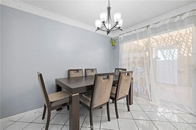 dining area with crown molding, light tile patterned floors, baseboards, and a notable chandelier