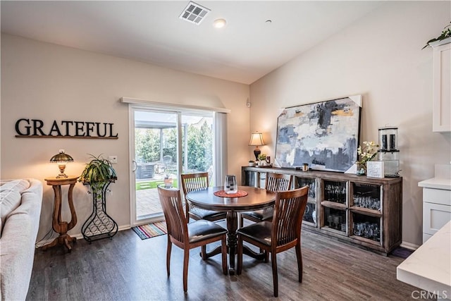 28340 Memory Ln, Winchester, CA 92596 - dining area featuring dark wood-type flooring, vaulted ceiling, visible vents, and baseboards