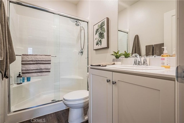 28340 Memory Ln, Winchester, CA 92596 - bathroom with toilet, vanity, wood finished floors, and a stall shower