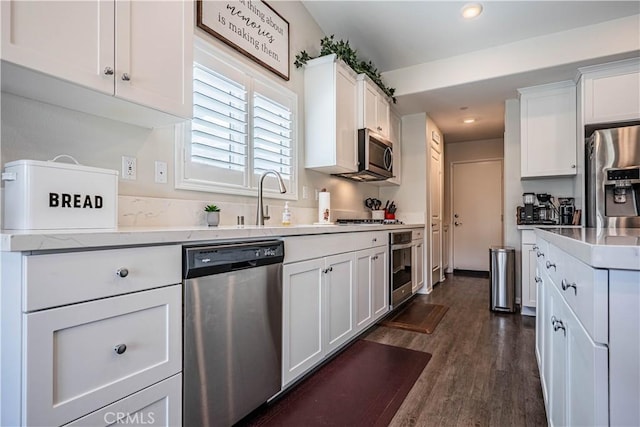 28340 Memory Ln, Winchester, CA 92596 - kitchen featuring white cabinets, stainless steel appliances, and dark wood-type flooring