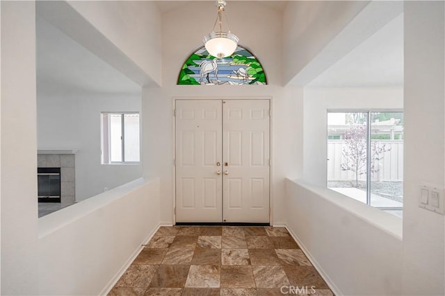 40108 Corte Lorca, Murrieta, CA 92562 - foyer entrance with stone finish floors and a tile fireplace