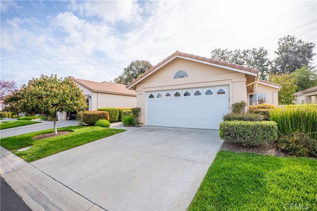 40108 Corte Lorca, Murrieta, CA 92562 - view of front of property featuring concrete driveway, stucco siding, a garage, and a tile roof