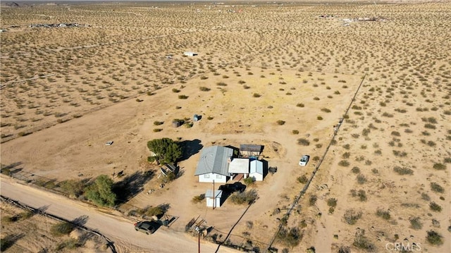bird's eye view with a mountain view, a desert view, and a rural view