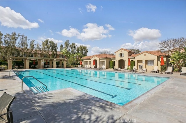 community pool featuring a patio area
