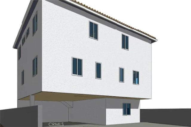 view of home's exterior featuring stucco siding and a tile roof