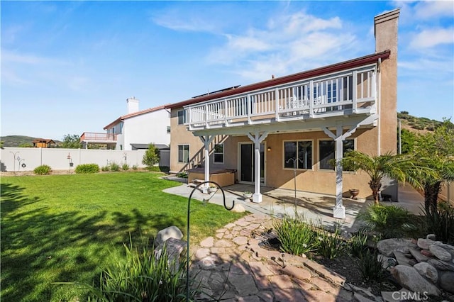 25302 Rolling Greens Way, Saugus, CA 91350 - back of house featuring a hot tub, a chimney, stucco siding, a patio area, and a deck