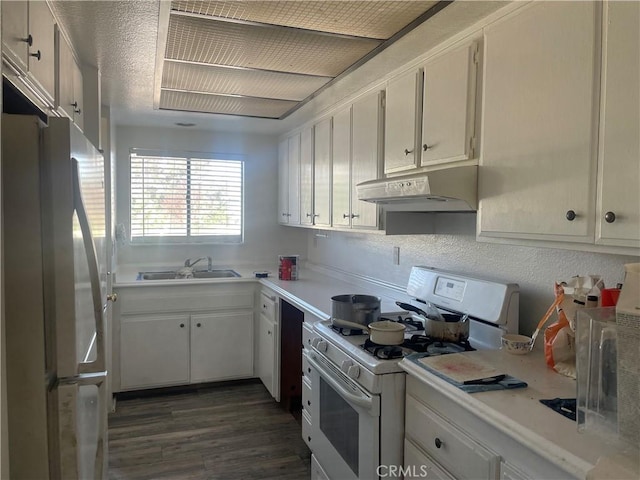 2168 Biscayne, Costa Mesa, CA 92627 - kitchen with a sink, white range with gas stovetop, light countertops, under cabinet range hood, and freestanding refrigerator