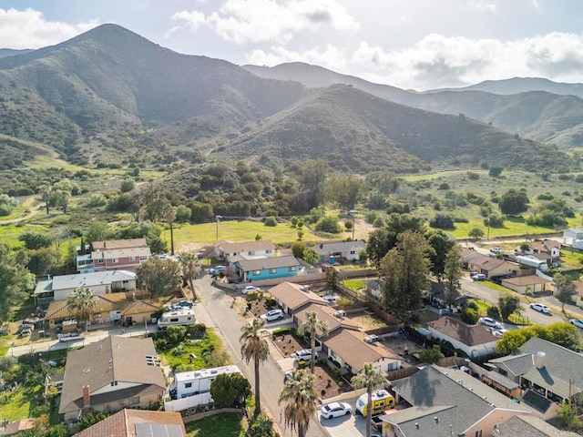 birds eye view of property with a mountain view and a residential view