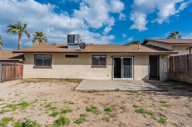 back of property with a patio, a fenced backyard, and stucco siding