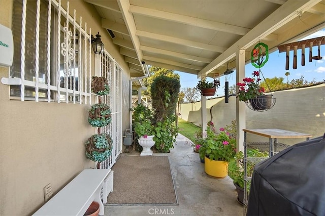 view of patio / terrace with area for grilling and fence