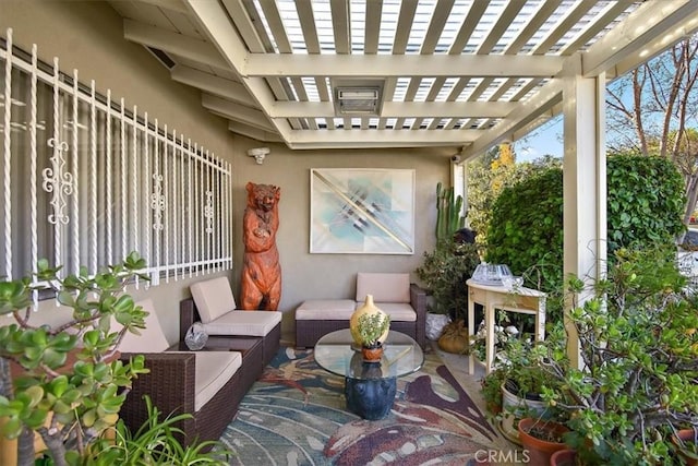 balcony with a pergola, an outdoor hangout area, and a patio area