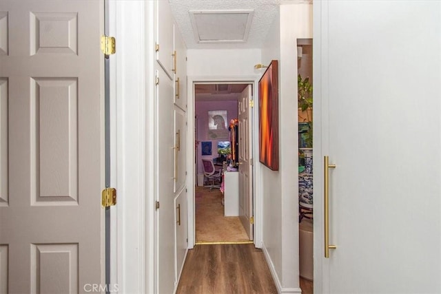 hall featuring dark wood finished floors and visible vents