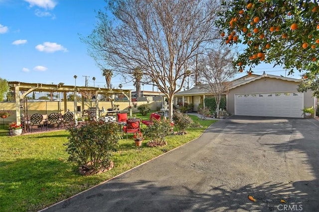 ranch-style home featuring stucco siding, a front lawn, driveway, and a garage