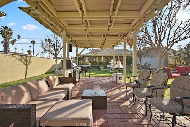 view of patio featuring fence and outdoor lounge area