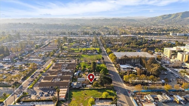 birds eye view of property featuring a mountain view