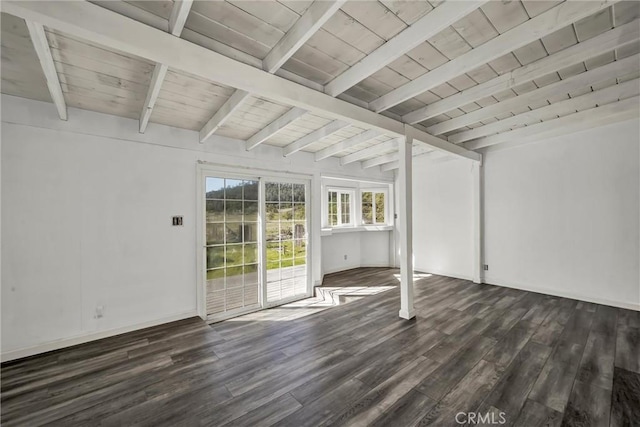 interior space with baseboards, beamed ceiling, wood finished floors, and wooden ceiling